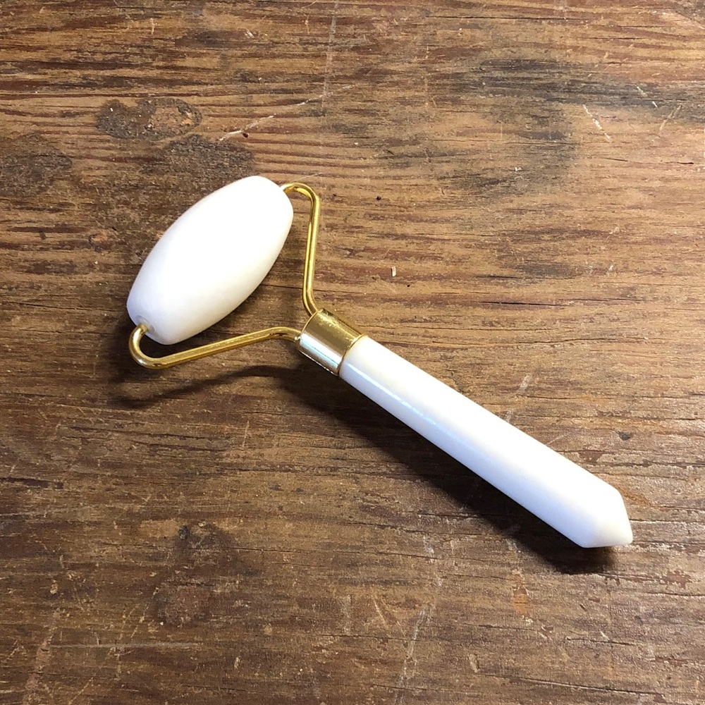 White Facial Roller with Gold Hardware